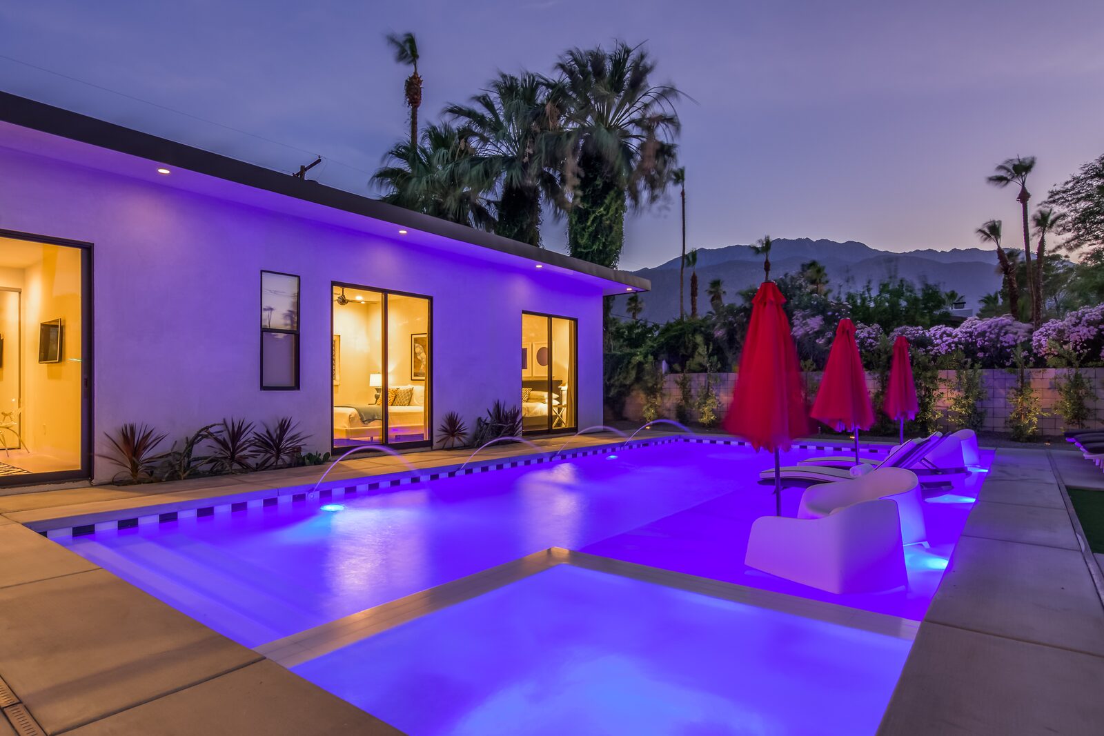 5 Palms Estate pool illuminated at dusk